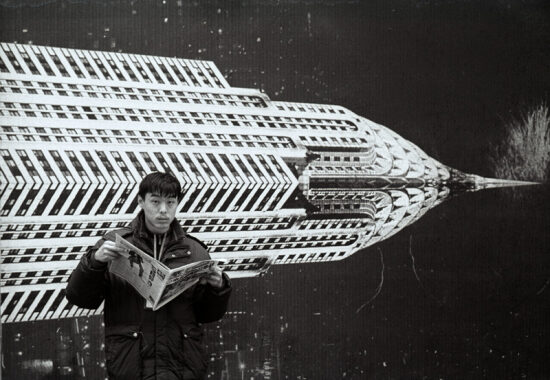 Men reading newspaper Shanghai 2009